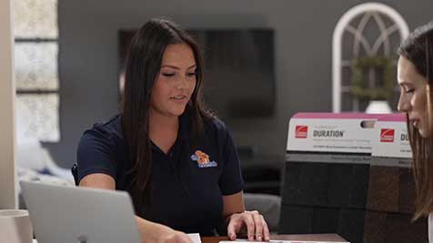 The-Third-Estimate-Estimator-_-Showing-Brochures-Smiling-_-3 The Third Estimate Estimator Showing Brochures Smiling 3