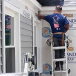 siding installation of gray siding on an exterior home