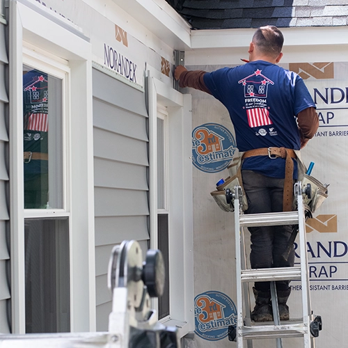 siding installation of gray siding on an exterior home