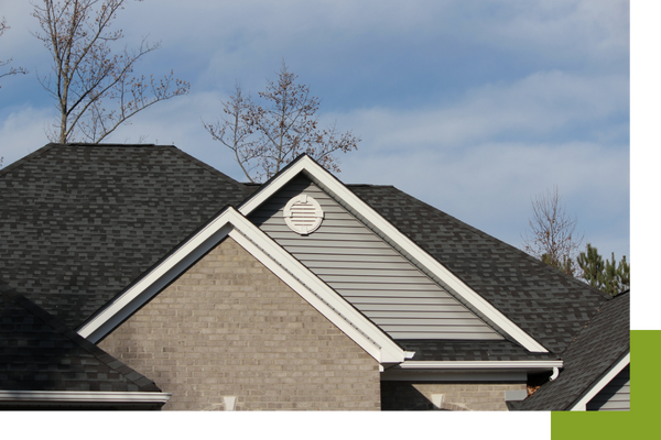 The top of a home displaying a roof in good condition