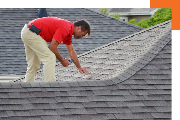 Man inspecting a roof