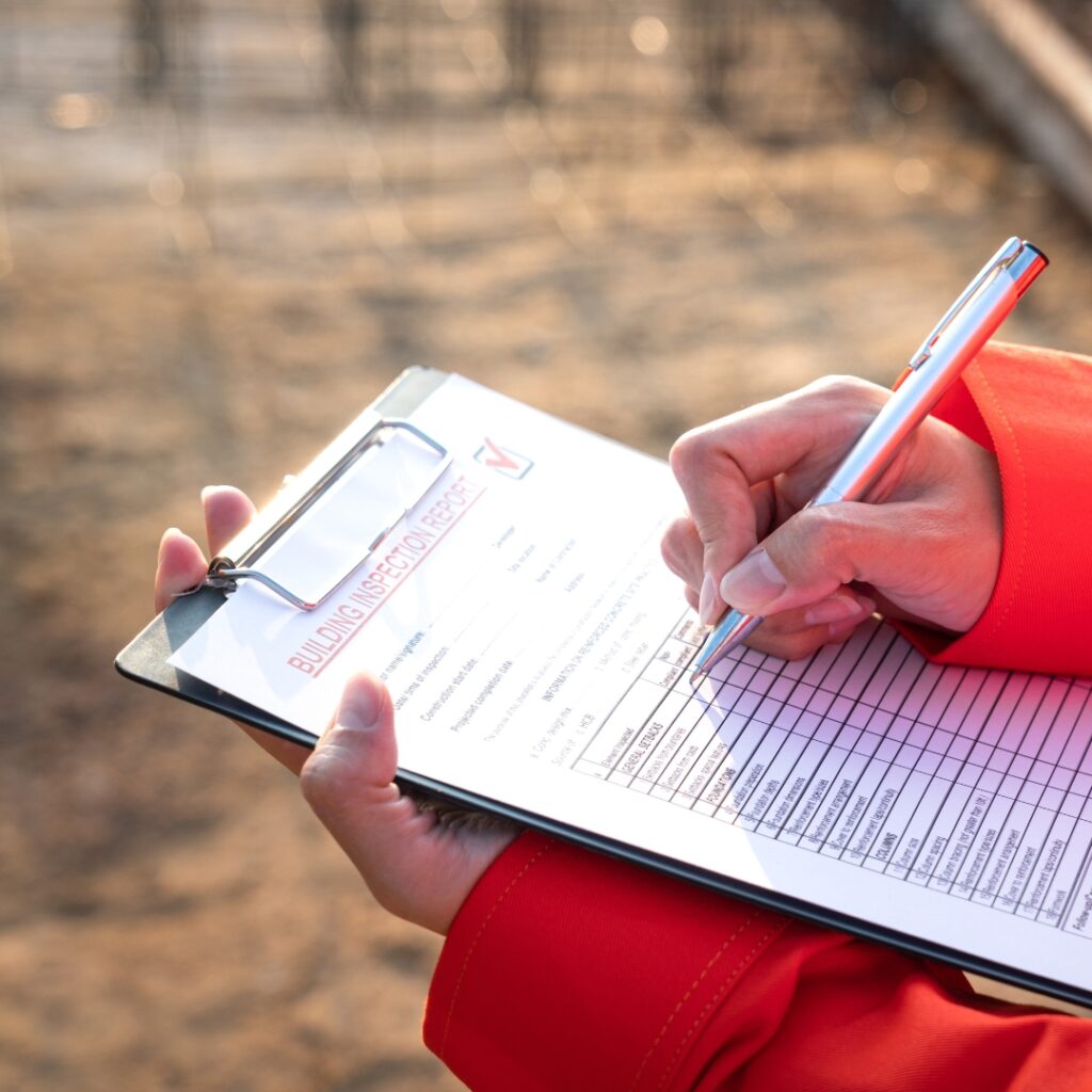 Filling out an checklist on a clipboard