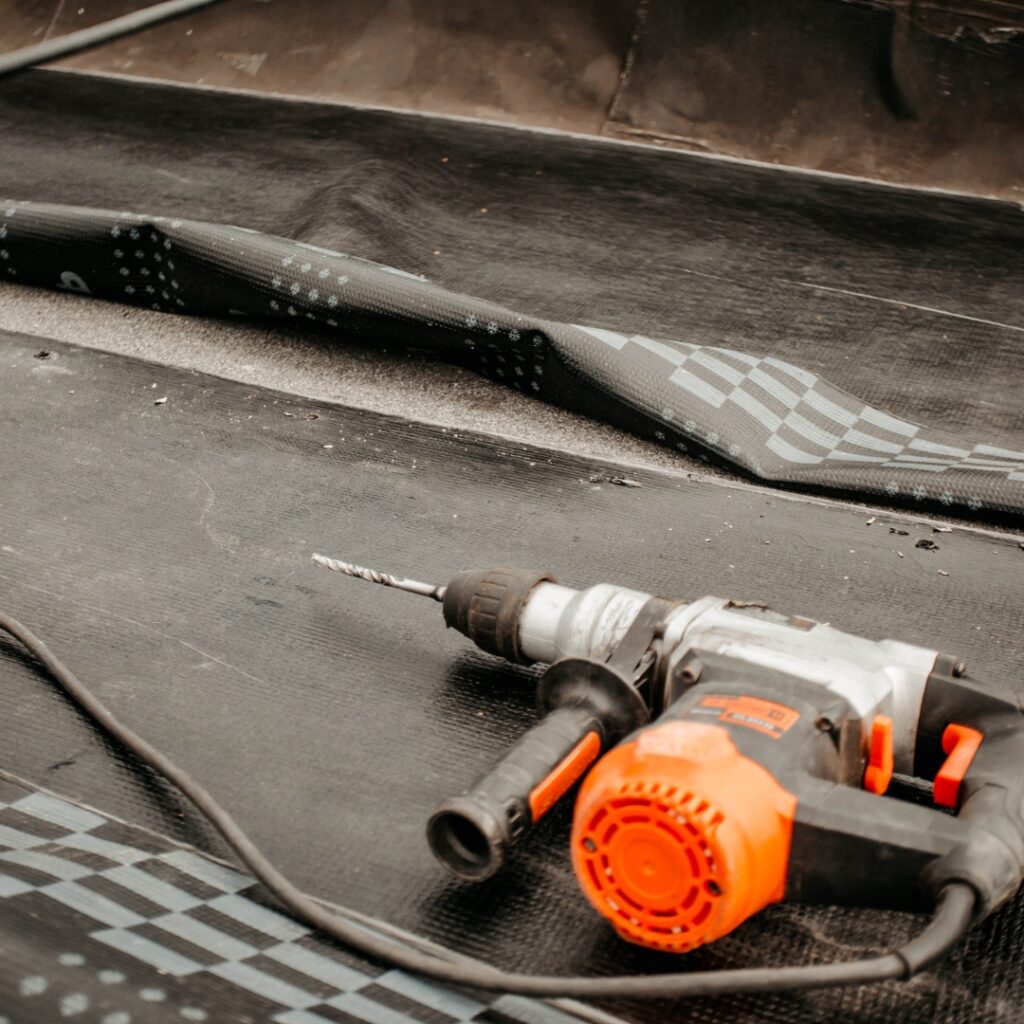 Drill gun resting on a roof