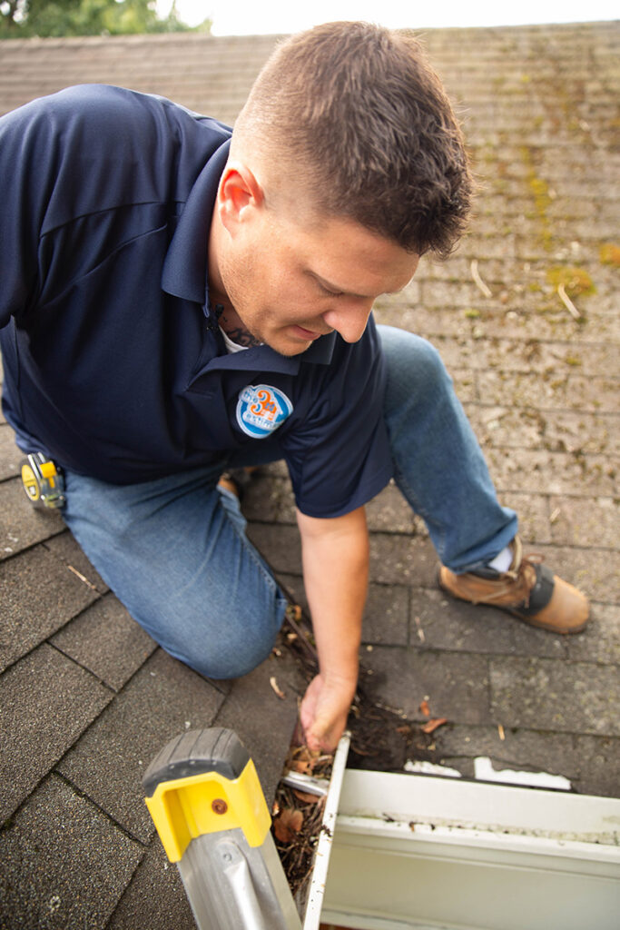 Roof Inspection Services: checking the gutters