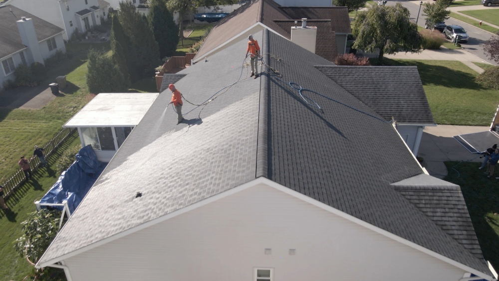 Residential house experiencing The Third Estimate roof rejuvenation: Eco Revive Roofing