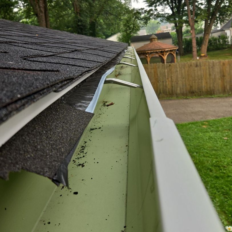 The Third Estimate crew inspecting the gutters of a residential home in Cuyahoga Falls, OH.