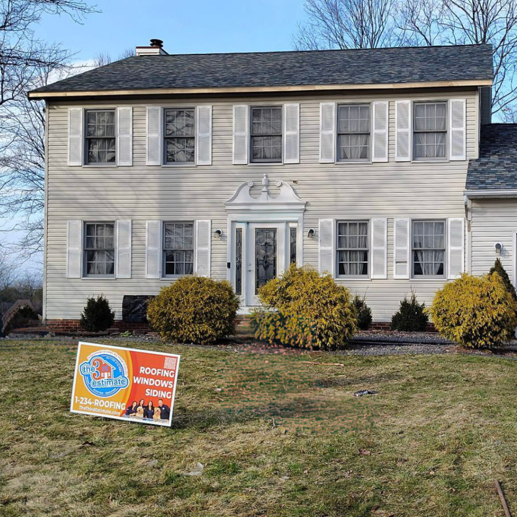 The Third Estimate yard sign place in front of a finished roof in Twinsburg.