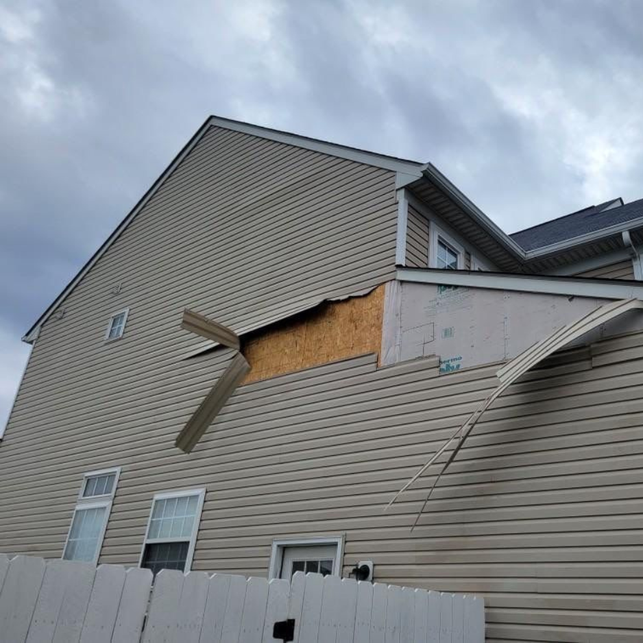 The Third Estimate crew assessing the storm damage of the residential home's siding in Northeast Ohio.