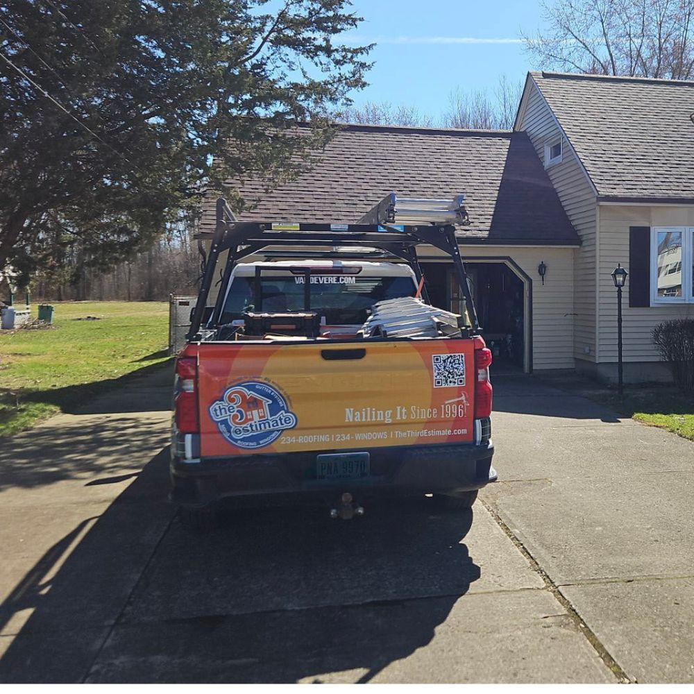 The Third Estimate crew van parked in front of a residential home in Grafton, OH.